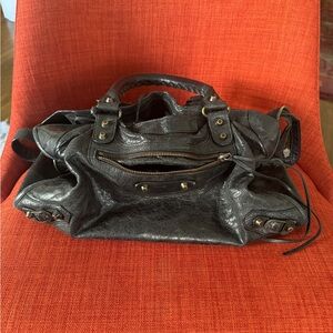 Balenciaga black lambskin handbag with two leather hand-braided handles.